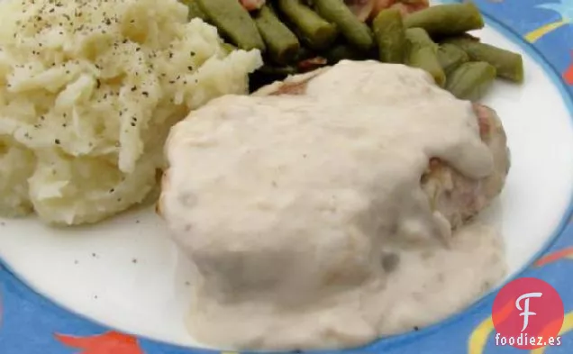 Chuletas de Cerdo Cubiertas con Salsa de Champiñones