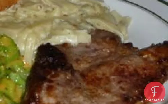Chuletas de Cerdo Fritas con Cebolla