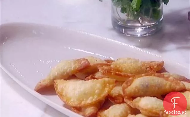 Ravioles de ricota y vainilla con salsa de naranja y menta